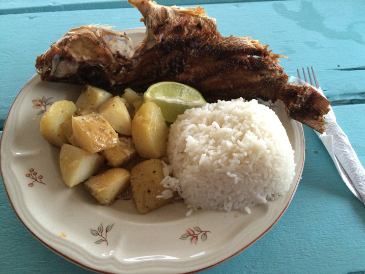 A plate with traditional fried fish and rice in Belize