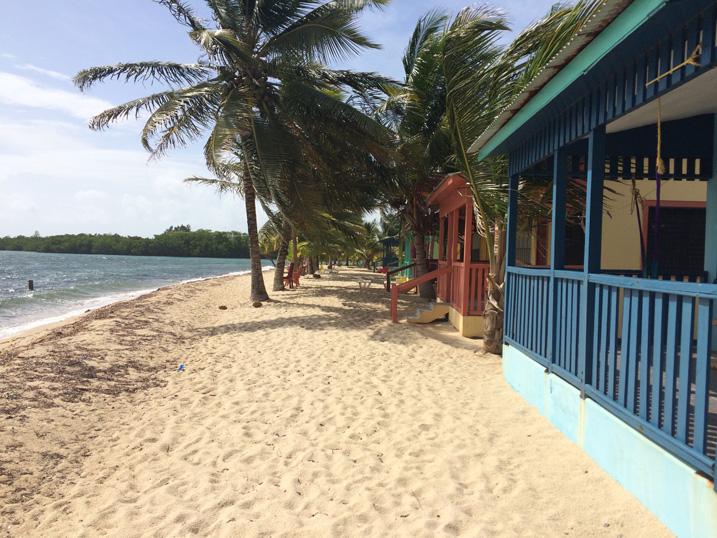 Pristine beach with waterfront shacks in Belize