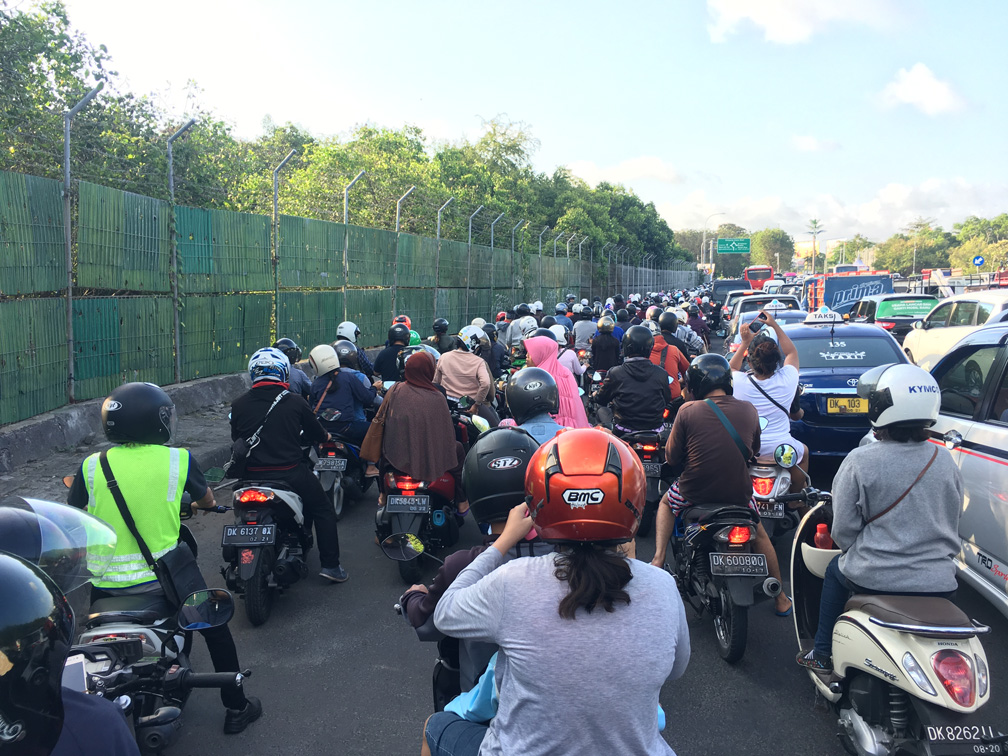 GoJek scooters in traffic in Bali Indonesia