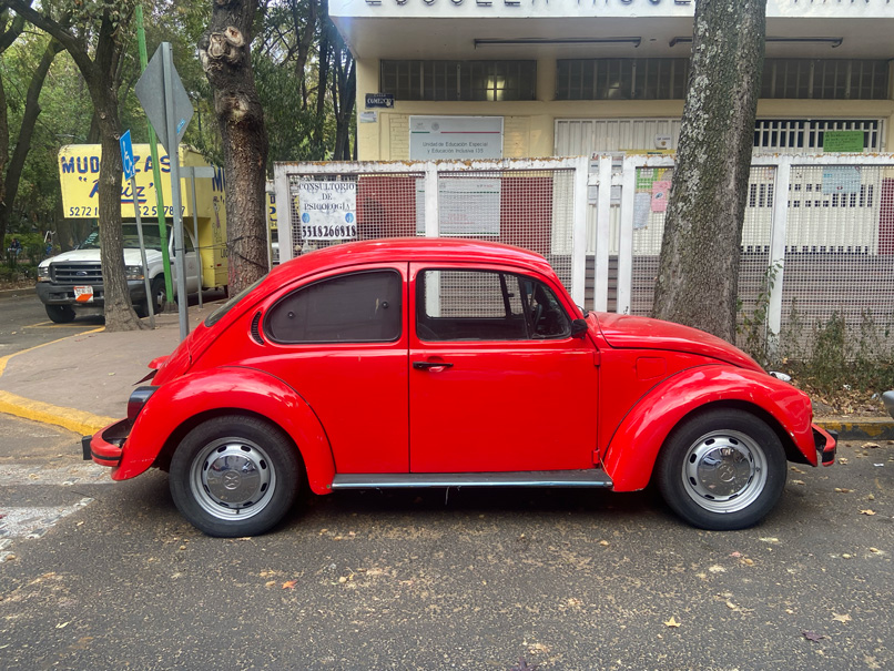 A red Volkswagen beetle in Guadalajara, Mexico